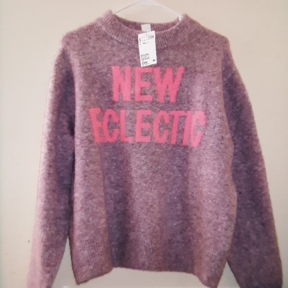 Soft knit sweater with a motif ,dropped shoulders.